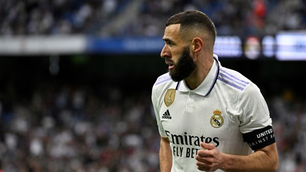 Real Madrid's French forward Karim Benzema celebrates scoring his team's first goal during the Spanish league football match between Real Madrid CF and Rayo Vallecano de Madrid at the Santiago Bernabeu stadium in Madrid on May 24, 2023. (Photo by JAVIER SORIANO / AFP)