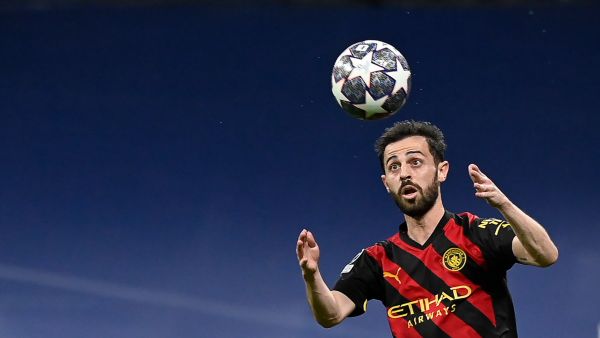 Manchester City's Portuguese midfielder Bernardo Silva eyes the ball during the UEFA Champions League semi-final first leg football match between Real Madrid CF and Manchester City at the Santiago Bernabeu stadium in Madrid on May 9, 2023. (Photo by OSCAR DEL POZO / AFP)