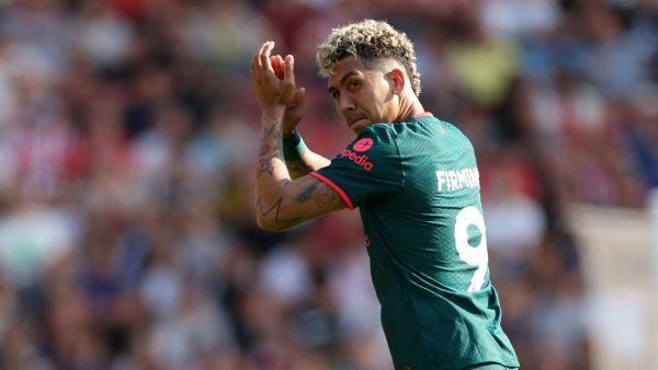 Liverpool's Brazilian striker Roberto Firmino applauds fans as he leaves on his final Liverpool appearance during the English Premier League football match between Southampton and Liverpool at St Mary's Stadium in Southampton, southern England on May 28, 2023. (Photo by Adrian DENNIS / AFP) 