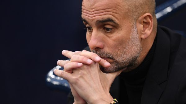 Manchester City's Spanish manager Pep Guardiola reacts ahead of the UEFA Champions League second leg semi-final football match between Manchester City and Real Madrid at the Etihad Stadium in Manchester, north west England, on May 17, 2023. (Photo by Oli SCARFF / AFP)