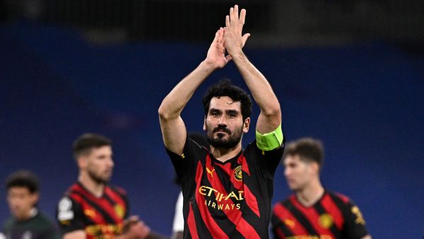 Manchester City's German midfielder Ilkay Gundogan applauds at the end of the UEFA Champions League semi-final first leg football match between Real Madrid CF and Manchester City at the Santiago Bernabeu stadium in Madrid on May 9, 2023. (Photo by JAVIER SORIANO / AFP)