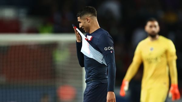 Paris Saint-Germain's Moroccan defender Achraf Hakimi leaves the pitch after receiving a red card during the French L1 football match between Paris Saint-Germain (PSG) and Ajaccio at the Parc des Princes in Paris, on May 13, 2023. (Photo by Anne-Christine POUJOULAT / AFP)
