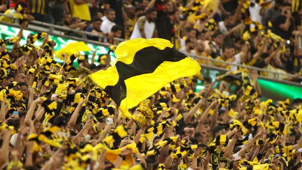 Ittihad supporters cheer during the Saudi Pro League football match between al-Ittihad and al-Hilal at the King Abdullah Sports City in Jeddah on May 23, 2022. (Photo by AFP)