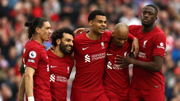 Liverpool's Egyptian striker Mohamed Salah (2L) celebrates with teammates after scoring his team's first goal during the English Premier League football match between Liverpool and Brentford at Anfield in Liverpool, north west England on May 6, 2023. (Photo by DARREN STAPLES / AFP)