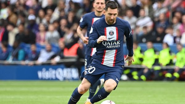 Paris Saint-Germain's Argentine forward Lionel Messi runs with the ball during the French L1 football match between Paris Saint-Germain (PSG) and FC Lorient at The Parc des Princes Stadium in Paris on April 30, 2023. (Photo by Alain JOCARD / AFP)