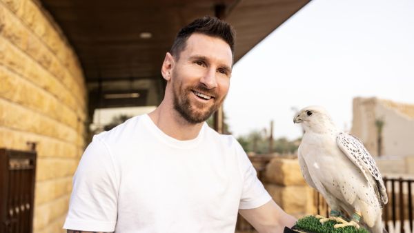 This handout picture provided by the Saudi Tourism Authority on May 1, 2023, shows Argentina's forward Lionel Messi holding a falcon in Riyadh. (Photo by Saudi Tourism Authority / AFP)