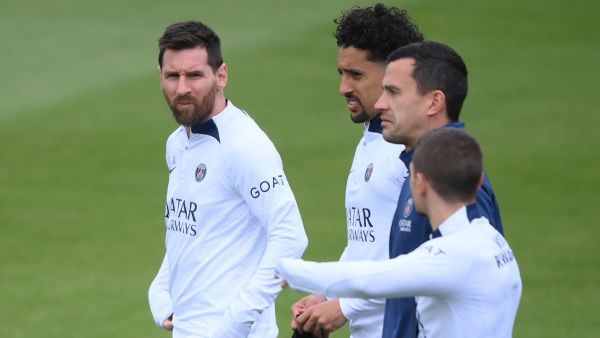 Paris Saint-Germain's Argentine forward Lionel Messi (L), Paris Saint-Germain's Brazilian defender Marquinhos and Paris Saint-Germain's Italian midfielder Marco Verratti (R) arrive for a training session of the French Ligue 1 football club Paris Saint-Germain (PSG) in Saint-Germain-en-Laye, in the north-western outskirts of Paris, on May 12, 2023. (Photo by FRANCK FIFE / AFP)