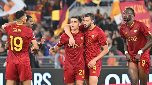 AS Roma's Argentinian forward Paulo Dybala (3rd L) and AS Roma's Italian midfielder Bryan Cristante (2nd R) celebrates with teammates after winning the UEFA Europa League semi-final first leg football match between AS Roma and Bayer Leverkusen at the Olympic Stadium in Rome on May 11, 2023. (Photo by Alberto PIZZOLI / AFP)