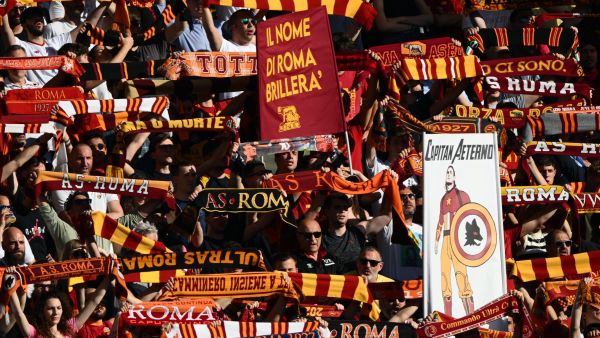 AS Rome fans cheer prior to the Italian Serie A football match between AS Rome and Inter Milan on May 6, 2023 at the Olympic stadium in Rome. (Photo by Vincenzo PINTO / AFP)