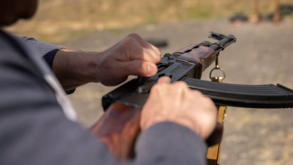 Iraqi brandishing rifle shoots at passers-by