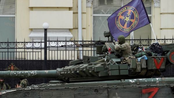 Members of Wagner group sit atop of a tank in a street in the city of Rostov-on-Don, on June 24, 2023.  (Photo by STRINGER / AFP) Wagner chief