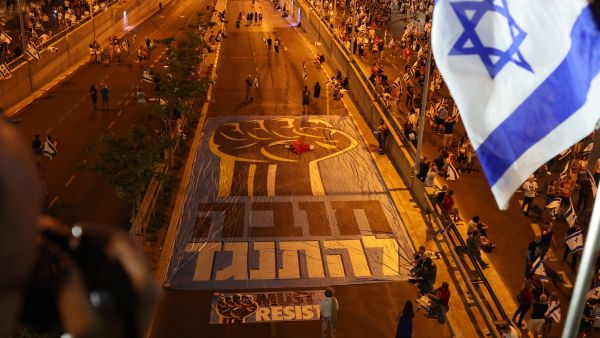 Demonstrators gather during a rally in Tel Aviv to protest the Israeli government's judicial overhaul plan, on June 24, 2023. (Photo by JACK GUEZ / AFP) Tel Aviv