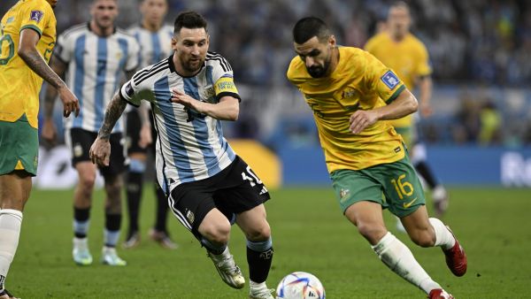 Argentina's forward #10 Lionel Messi (L) fights for the ball with Australia's defender #16 Aziz Behich during the Qatar 2022 World Cup round of 16 football match between Argentina and Australia at the Ahmad Bin Ali Stadium in Al-Rayyan, west of Doha on December 3, 2022. (Photo by Alfredo ESTRELLA / AFP)