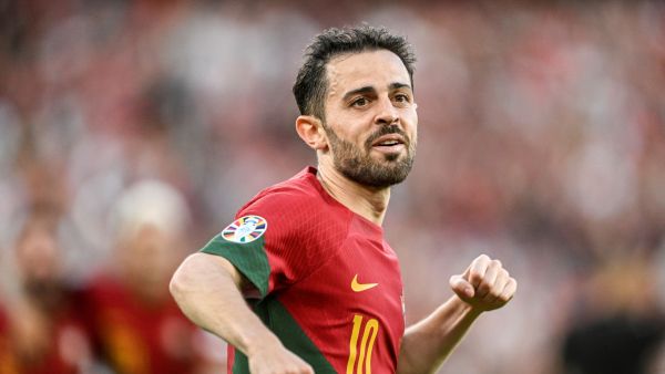 Portugal's midfielder Bernardo Silva celebrates after scoring his team's first goal during the UEFA Euro 2024 group J qualification football match between Portugal and Bosnia-Herzegovina at the Luz stadium in Lisbon on June 17, 2023. (Photo by Patricia DE MELO MOREIRA / AFP)