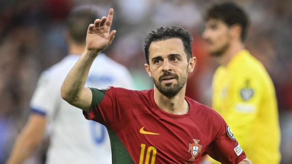 Portugal's midfielder Bernardo Silva celebrates after scoring his team's first goal during the UEFA Euro 2024 group J qualification football match between Portugal and Bosnia-Herzegovina at the Luz stadium in Lisbon on June 17, 2023. (Photo by Patricia DE MELO MOREIRA / AFP)
