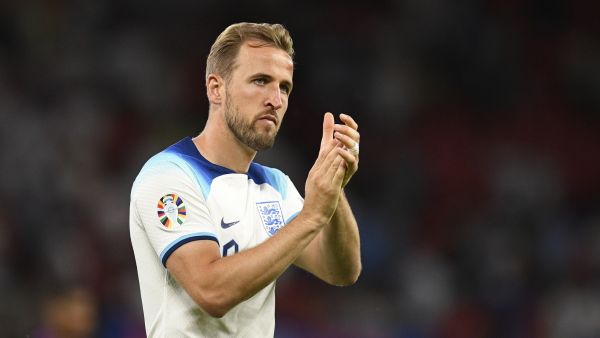 England's striker Harry Kane applauds fans on the pitch after the UEFA Euro 2024 group C qualification football match between England and North Macedonia at Old Trafford in Manchester, north west England, on June 19, 2023. England won the game 7-0. (Photo by Oli SCARFF / AFP)