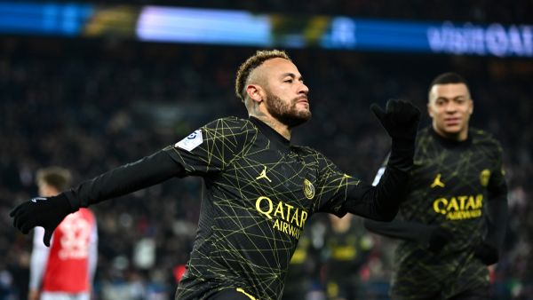 Paris Saint-Germain's Brazilian forward Neymar celebrates with teammates after scoring the opening goal during the French L1 football match between Paris Saint-Germain (PSG) and Stade de Reims at the Parc des Princes stadium in Paris on January 29, 2023. (Photo by Anne-Christine POUJOULAT / AFP)