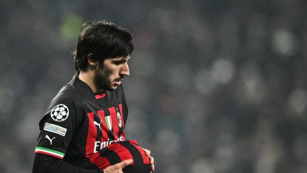 AC Milan's Italian midfielder Sandro Tonali cleans the ball during the UEFA Champions League round of 16 second-leg football match between Tottenham Hotspur and Milan AC at Tottenham Hotspur Stadium in London on March 8, 2023. (Photo by JUSTIN TALLIS / AFP)