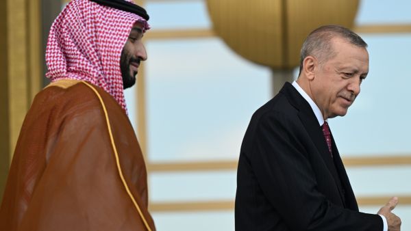 Saudi Crown Prince Mohammed bin Salman (L) follows Turkish President Recep Tayyip Erdogan upon his arrival during an official ceremony at the Presidential Complex in Ankara on June 22, 2022. (Photo by OZAN KOSE / AFP) Erdogan gifts Saudi Crown Prince Togg car