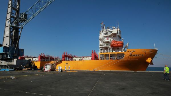 Forensics experts inspect the site of a toxic gas explosion by the Hong Kong-flagged vessel "Forest 6" in Jordan's Red Sea port of Aqaba on June 28, 2022. (Photo by Khalil MAZRAAWI / AFP) Aqaba