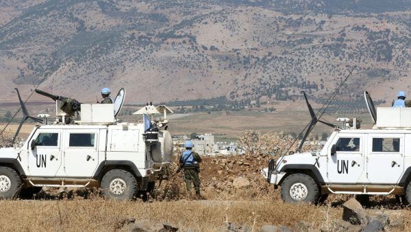 Peacekeepers with the United Nations Interim Force in Lebanon (UNIFIL) patrol an area on the Lebanon-Israel border on July 6, 2023. (Photo by Mahmoud ZAYYAT / AFP) UNIFIL