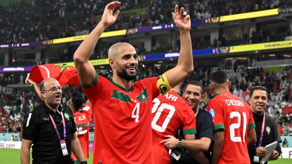 Morocco's midfielder #04 Sofyan Amrabat celebrates after winning the Qatar 2022 World Cup quarter-final football match between Morocco and Portugal at the Al-Thumama Stadium in Doha on December 10, 2022. (Photo by PATRICIA DE MELO MOREIRA / AFP)