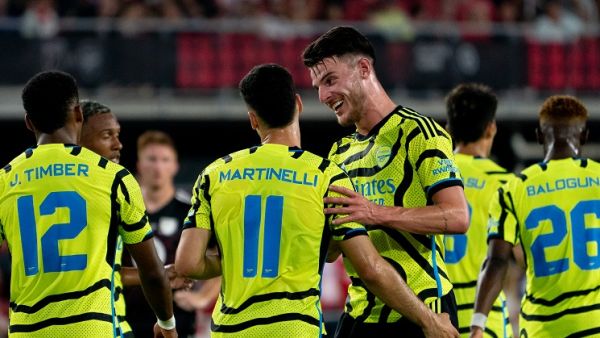 Arsenal's Declan Rice celebrates with teammate Gabriel Martinelli after Martinelli scored a goal during a friendly football match between the Major League Soccer (MLS) All-Star team and Arsenal FC, at Audi Field in Washington, DC, on July 19, 2023. (Photo by Stefani Reynolds / AFP)