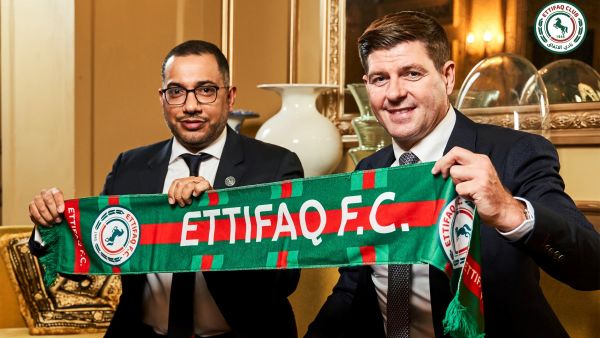 This handout picture released by Saudi Arabia's al-Ettifaq football club on July 3, 2023 shows Ettifaq's new English manager Steven Gerrard (R) with the club's President Khaled al-Debel after signing with them in London. (Photo by Al Ettifaq Football Club / AFP)
