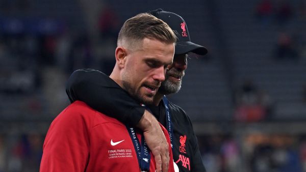 Liverpool's English midfielder Jordan Henderson (L) and Liverpool's German manager Jurgen Klopp react during the medal ceremony at the end of the UEFA Champions League final football match between Liverpool and Real Madrid at the Stade de France in Saint-Denis, north of Paris, on May 28, 2022. Real Madrid claimed a 14th European Cup after beating Liverpool 1-0 in the Champions League final at the Stade de France, in France. (Photo by Paul ELLIS / AFP)