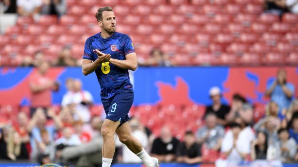 England's striker Harry Kane comes out to warm up ahead of the UEFA Euro 2024 group C qualification football match between England and North Macedonia at Old Trafford in Manchester, north west England, on June 19, 2023. (Photo by Oli SCARFF / AFP)