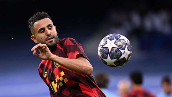 Manchester City's Algerian midfielder Riyad Mahrez warms up before the start of the UEFA Champions League semi-final first leg football match between Real Madrid CF and Manchester City at the Santiago Bernabeu stadium in Madrid on May 9, 2023. (Photo by OSCAR DEL POZO / AFP)