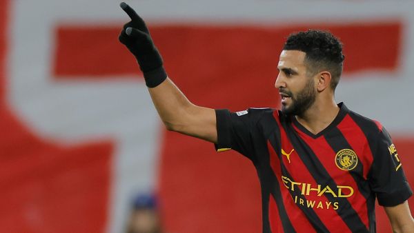 Manchester City's Algerian midfielder Riyad Mahrez celebrates scoring the opening goal during the UEFA Champions League round of 16, first-leg football match between RB Leipzig and Manchester City in Leipzig, eastern Germany on February 22, 2023. (Photo by Odd ANDERSEN / AFP)