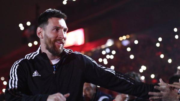 Argentine football player Lionel Messi greets fans during his entrance to the field before the start of Maximiliano Rodriguez's farewell match at the Marcelo Bielsa stadium in Rosario, Argentina on January 24, 2023. (Photo by STRINGER / AFP)