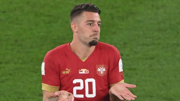 Serbia's midfielder #20 Sergej Milinkovic-Savic reacts after receiving a yellow card during the Qatar 2022 World Cup Group G football match between Serbia and Switzerland at Stadium 974 in Doha on December 2, 2022. (Photo by Patrick T. Fallon / AFP)