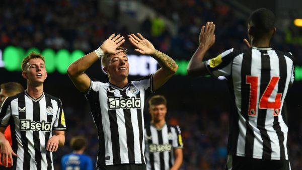 Newcastle United's Scottish defender Harrison Ashby (C) celebrates after scoring their second goal during the pre-season friendly football match between Rangers and Newcastle United at the Ibrox Stadium, in Glasgow, on July 18, 2023. (Photo by ANDY BUCHANAN / AFP)