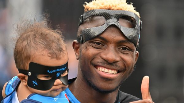 Napoli's Nigerian forward Victor Osimhen holds his daughter Hailey True prior to the Italian Serie A football match between Napoli and Sampdoria on June 4, 2023 at the Diego-Maradona stadium in Naples. (Photo by Alberto PIZZOLI / AFP)