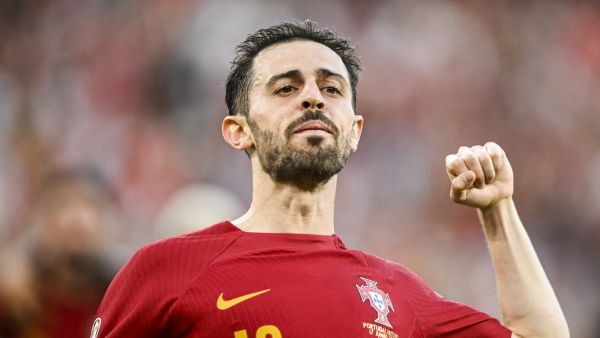 Portugal's midfielder Bernardo Silva celebrates after scoring his team's first goal during the UEFA Euro 2024 group J qualification football match between Portugal and Bosnia-Herzegovina at the Luz stadium in Lisbon on June 17, 2023. (Photo by Patricia DE MELO MOREIRA / AFP)