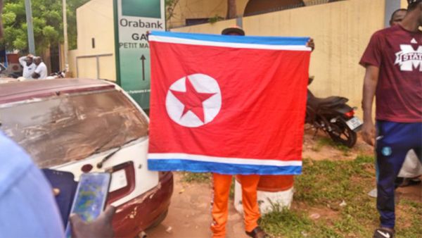 Niger pro-junta protester was seen carrying North Korean flag. (X/Twitter) North Korean flag