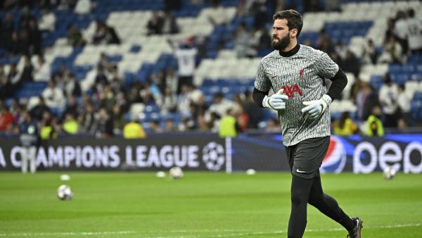 Liverpool's Brazilian goalkeeper Alisson Becker warms up ahead of the UEFA Champions League last 16 second leg football match between Real Madrid CF and Liverpool FC at the Santiago Bernabeu stadium in Madrid on March 15, 2023. (Photo by JAVIER SORIANO / AFP)