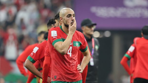 Morocco's midfielder #04 Sofyan Amrabat reacts to his team's defeat in the Qatar 2022 World Cup semi-final football match between France and Morocco at the Al-Bayt Stadium in Al Khor, north of Doha on December 14, 2022. (Photo by KARIM JAAFAR / AFP)