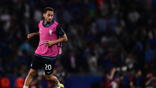 Inter Milan's Turkish midfielder #20 Hakan Calhanoglu warms up ahead of the UEFA Champions League final football match between Inter Milan and Manchester City at the Ataturk Olympic Stadium in Istanbul, on June 10, 2023. (Photo by Marco BERTORELLO / AFP)