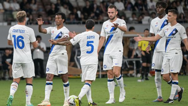 Members of Inter Milan celebrate after teammate Italian forward Sebastiano Esposito (not pictured) scored the equaliser during the football friendly match between Italy's Inter Milan and France's Paris Saint-Germain (PSG) at the National Stadium in Tokyo on August 1, 2023. (Photo by Richard A. Brooks / AFP)