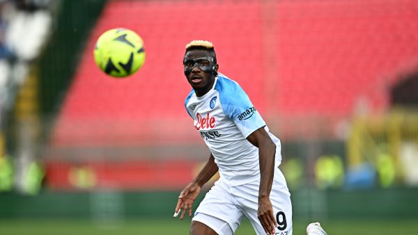Napoli's Nigerian forward Victor Osimhen runs with the ball during the Italian Serie A football match between Monza and Napoli on May 14, 2023 at the Brianteo stadium in Monza. (Photo by GABRIEL BOUYS / AFP)
