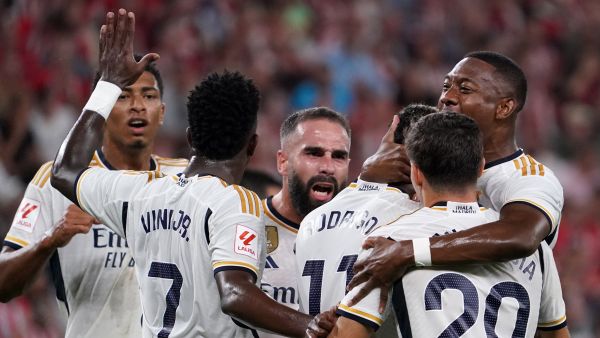 Real Madrid's Brazilian forward #11 Rodrygo celebrates scoring the opening goal during the Spanish Liga football match between Athletic Bilbao and Real Madrid at the San Mames stadium in Bilbao on August 12, 2023. (Photo by CESAR MANSO / AFP)