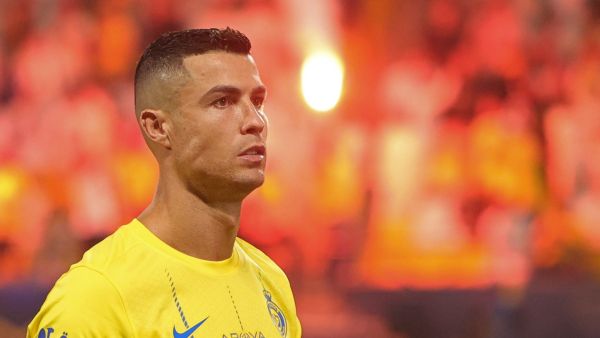 Nassr's Portuguese forward #07 Cristiano Ronaldo stands for the national anthem before the start of the Saudi Pro League football match between Al-Nassr and Al-Taawoun at King Saud University Stadium in Riyadh on August 18, 2023. (Photo by Fayez Nureldine / AFP)