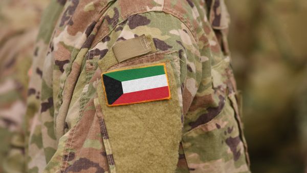 Kuwait flag on soldiers arm (collage)