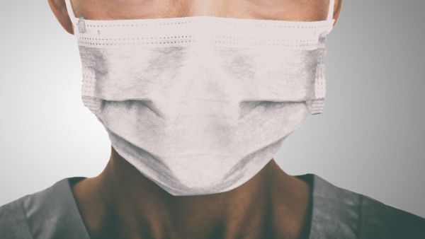 Doctor wearing protection face mask against coronavirus