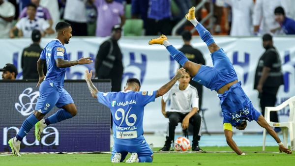 Hilal's Saudi midfielder #29 Salem al-Dawsari (R) celebrates after a goal during the Saudi Pro League football match between Al-Ittihad and Al-Hilal at Prince Abdullah al-Faisal Stadium in Jeddah on September 1, 2023. (Photo by AFP)