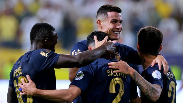 Nassr's Saudi defender #02 Sultan al-Ghanam (C) celebrates his goal with his teammates during the Saudi Pro League football match between Al-Nassr and Al-Shabab in Riyadh's Al-Awal Park Stadium on August 29, 2023. (Photo by Fayez NURELDINE / AFP)