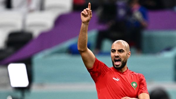 Morocco's midfielder #04 Sofyan Amrabat warms up ahead of the Qatar 2022 World Cup semi-final football match between France and Morocco at the Al-Bayt Stadium in Al Khor, north of Doha on December 14, 2022. (Photo by GABRIEL BOUYS / AFP)
